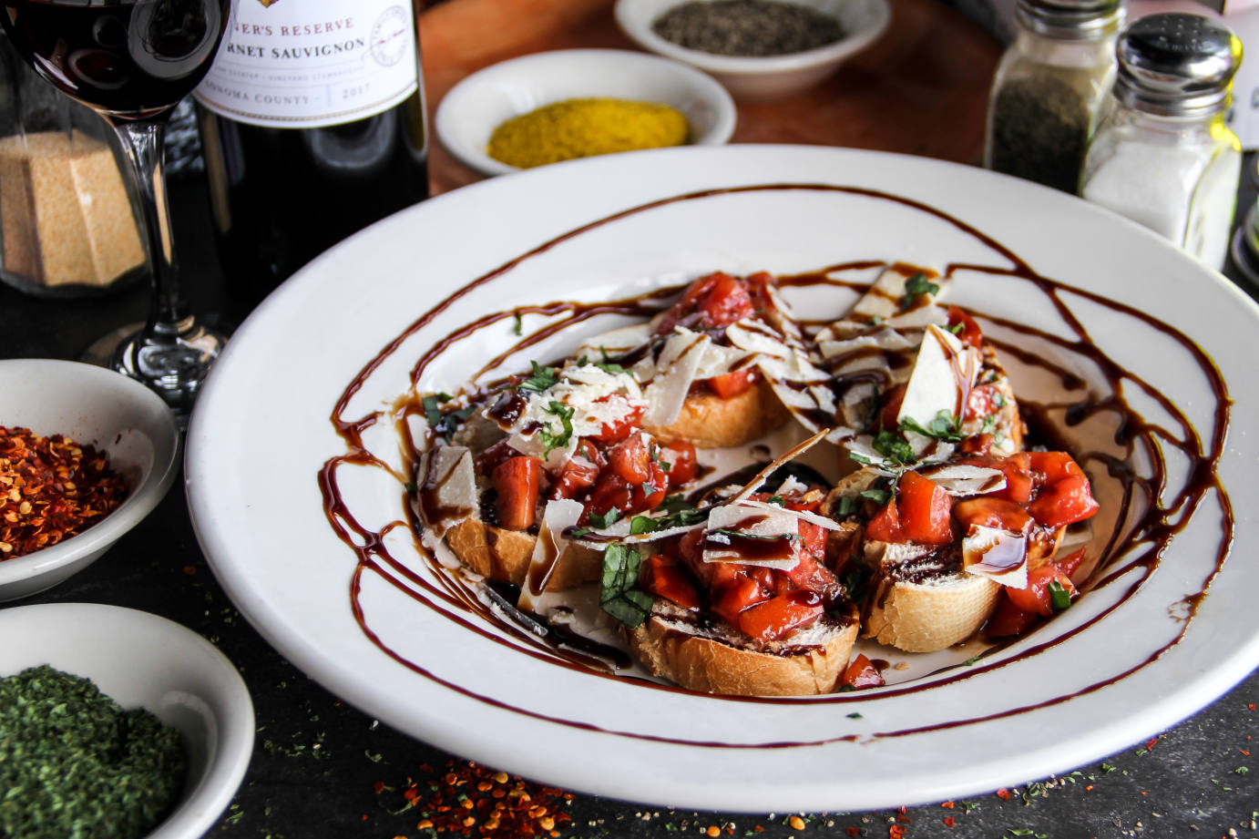 Bruschetta and a glass of red on the table